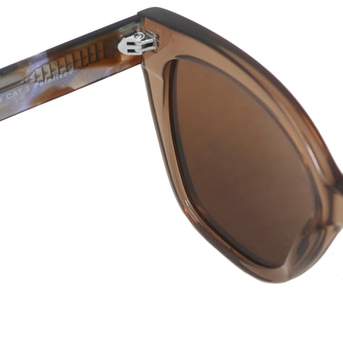 Close-up of a sunglasses with brown lenses on a white background