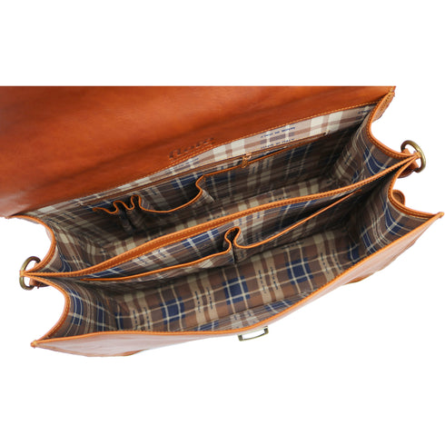 Brown leather bag with plaid interior on a white background