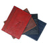 Stack of leather cardholders in red, brown, black, and blue on a white background