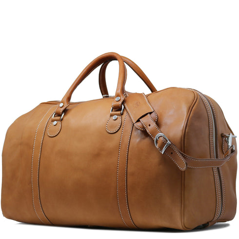 The Floto Parma Duffle Bag is a leather weekender that is handcrafted in Italy with our famous Parma leather. Parma leather is tanned in a special way with no chemicals so the bag will get better as it ages - each travel bag takes on a unique look and darkens like a saddle over time. Parma is leather tanning the natural way.