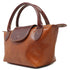 Floto Gattane Brown leather handbag with matching handle on a white background