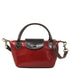 Floto Gattane Red handbag with brown handle and strap on a white background
