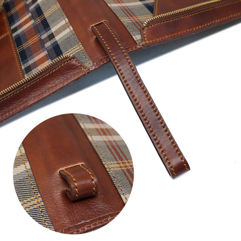 The Floto Venezia Laptop Case is a leather portfolio that is structured and has a brass zipper closure. It can hold a small size laptop and it is handcrafted in Italy with natural full grain leather. This is the Venezia Laptop Case in Vecchio Brown. 3