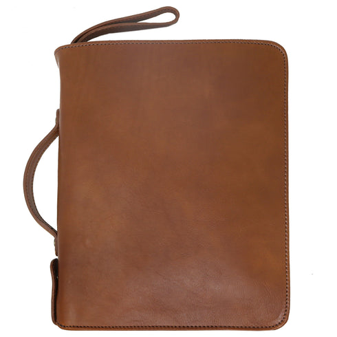The Floto Venezia Laptop Case is a leather portfolio that is structured and has a brass zipper closure. It can hold a small size laptop and it is handcrafted in Italy with natural full grain leather. This is the Venezia Laptop Case in Tobacco Brown.