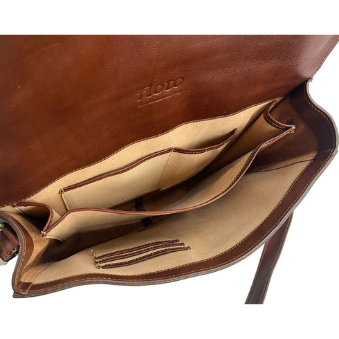 The Floto Firenze leather messenger bag is a men's casual crossbody bag that is handcrafted in Italy. This is the Firenze Messenger in Saddle Brown. 9