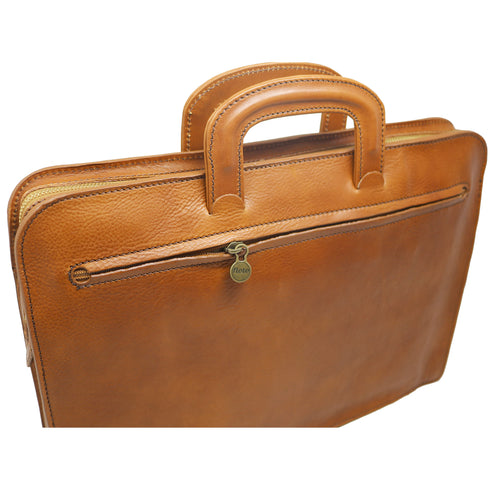 The Floto Milano Sleeve leather briefcase is a men's slime attache bag that is handcrafted in Italy. This is the Milano Sleeve in tobacco brown. 3