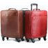Brown and red leather suitcases with wheels on a white background