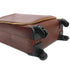 Brown suitcase with wheels on a white background