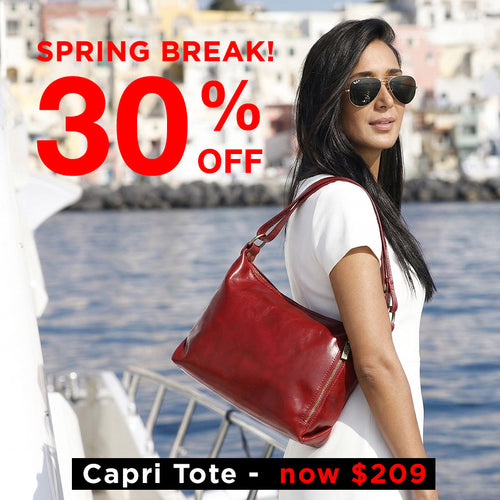 Woman with a red tote bag by water, promotional text for 'Spring Break! 30% Off Capri Tote now $209'.
