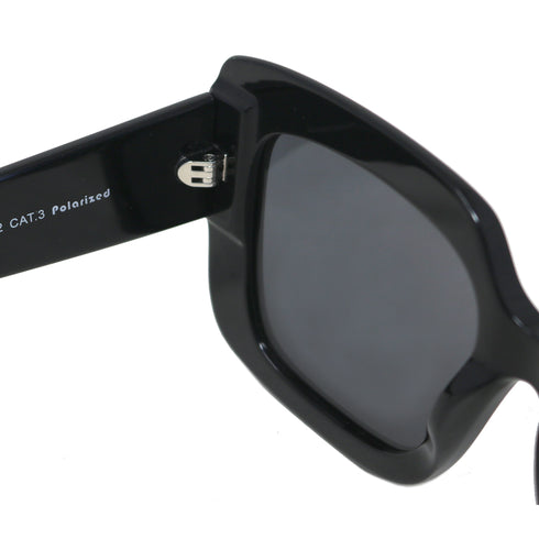 Black sunglasses with a reflective lens on a white background