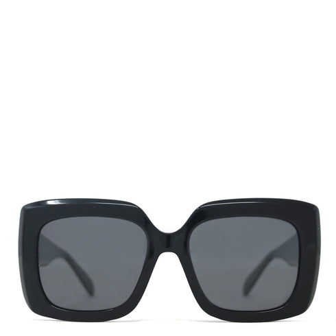 Black sunglasses with dark lenses on a white background