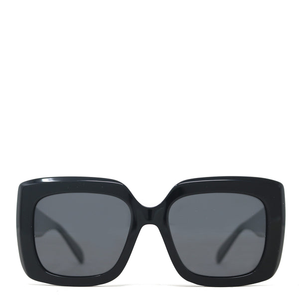 Black sunglasses with dark lenses on a white background