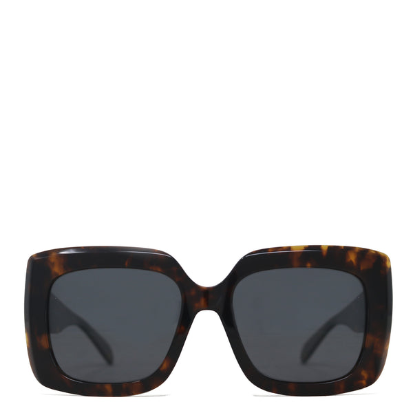 Sunglasses with tortoiseshell frame and dark lenses on a white background