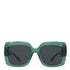 Green sunglasses with dark lenses on a white background