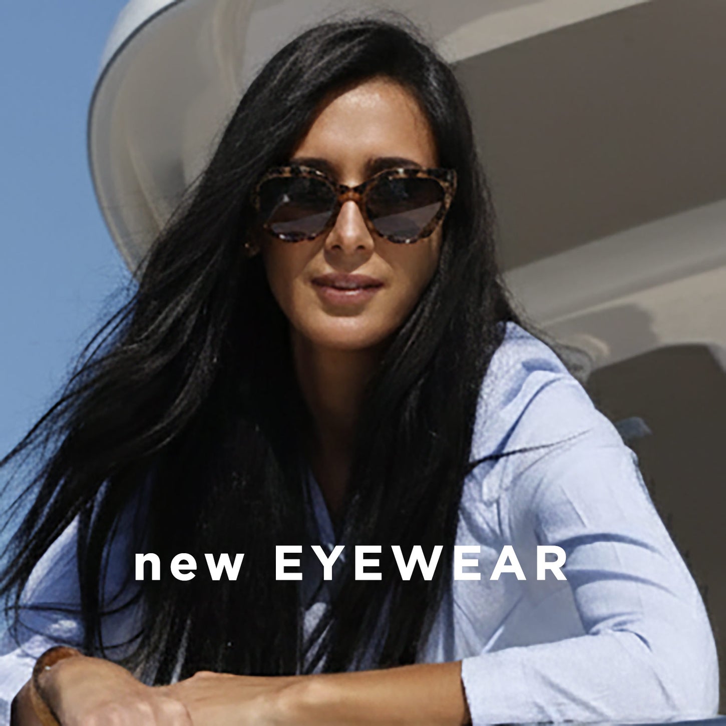Woman wearing sunglasses with 'new EYEWEAR' text overlay