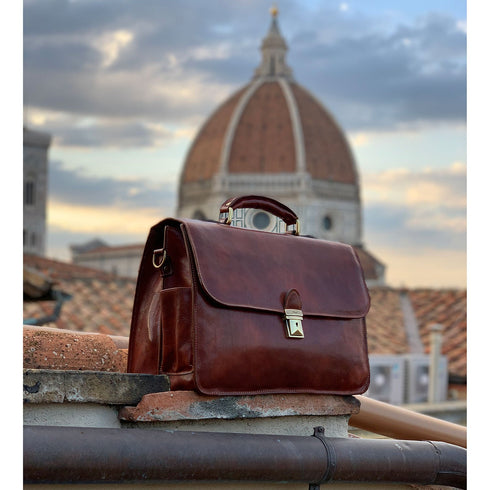 The Floto Duomo leather briefcase is a men's attache business bag that is handcrafted in Italy. This is the Duomo Brief in Vecchio Brown pictured with the actual Duomo of Florence in the background.