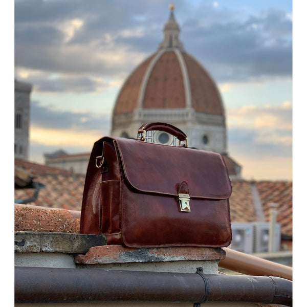 The Floto Duomo leather briefcase is a men's attache business bag that is handcrafted in Italy. This is the Duomo Brief in Vecchio Brown pictured with the actual Duomo of Florence in the background.