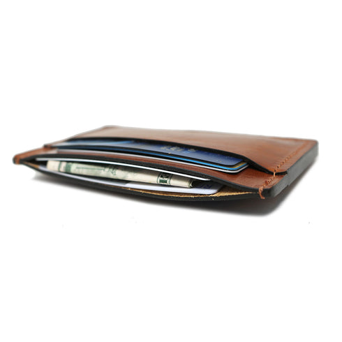 This is a Floto Wallet made from full grain calfskin leather. This model is the Sono Wide Card Wallet in Brown. 3